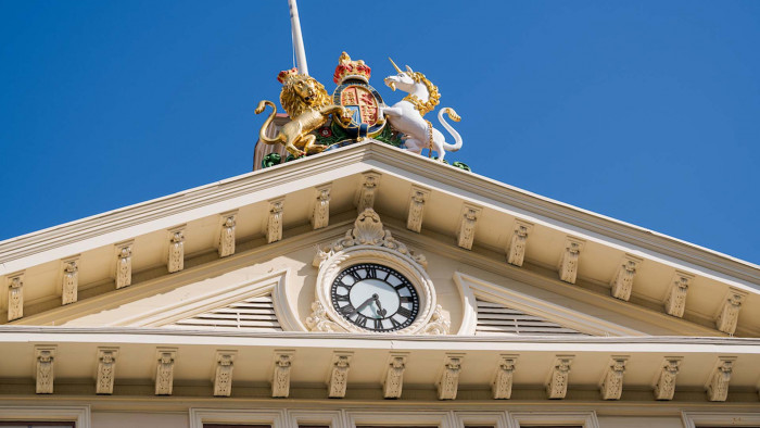 Top of Old Government Buildings including the clock and royal coat of arms - a lion and unicorn