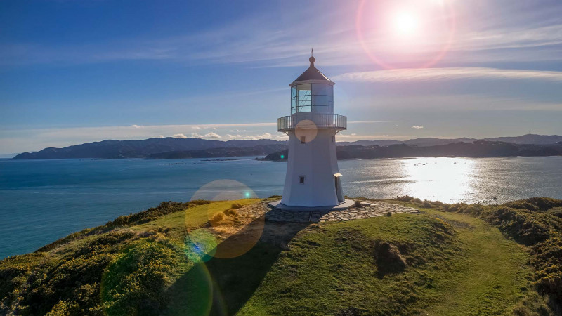 View of Pencarrow Lighthouse with Wellington harbour in the background