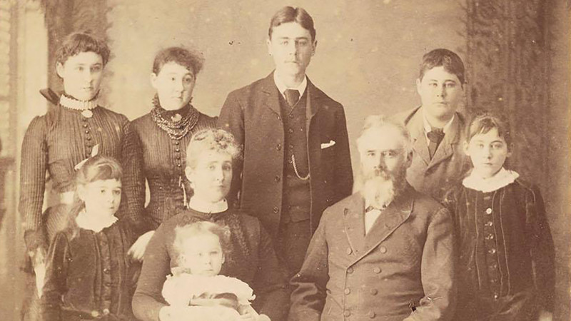 The Kerr Taylor family gather together in their best outfits to pose for an official photo. 