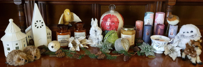 A selection of gifts available at the Highwic Christmas shop including Christmas decorations, honey and candles.